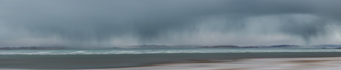 picturesque view of sea surrounded by rocky coast in morning 