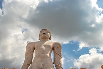 idol of a deity stone statue symbolizing Peace in Jainism with blue sky from different angles