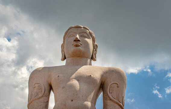 idol of a deity stone statue symbolizing Peace in Jainism with blue sky from different angles