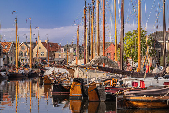 View of the harbor of the Dutch fishing village of Spakenburg in the former Zuiderzee with old traditional Botter fishing boats.