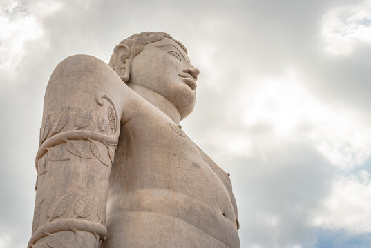 idol of a deity stone statue symbolizing Peace in Jainism with blue sky from different angles