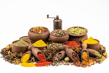 Spices and seasonings in wooden tableware by close up isolated on a white background.