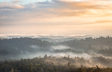 Fototapeta premium mountain layers covered with white mist at dawn
