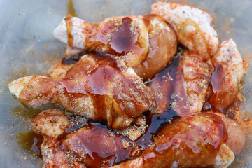 chicken  mixed with sauce and herbal ingredient in cooking grilled