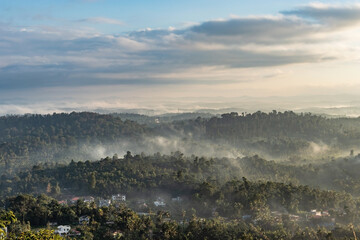 Fototapeta na wymiar mountain covered with white mist at dawn