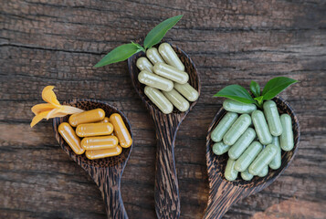 herbal medicine from organic herbs on wooden spoon for health care eating in daily life