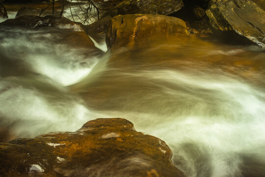 waterfall with milky white water flow long exposure flat angle image
