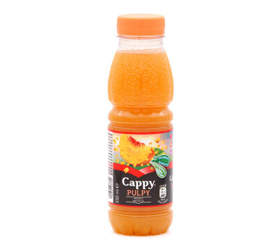 BUCHAREST, ROMANIA - JANUARY 16, 2020. Bottle of Cappy Pulpy Peach fruit juice isolated on white 