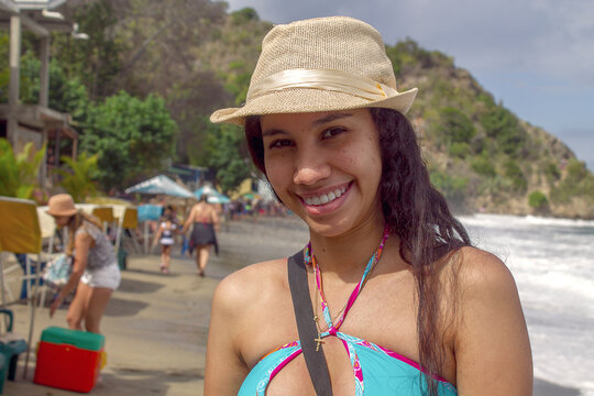 Caribbean girl in a village on the edge of the mountain with its sea of strong waves in front in chichiriviche de la Costa, Vargas Venezuela