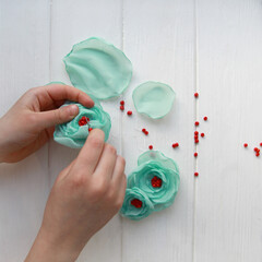 How to make a flower brooch from organza. Step 5. Sew the petals by putting them one on top of the...