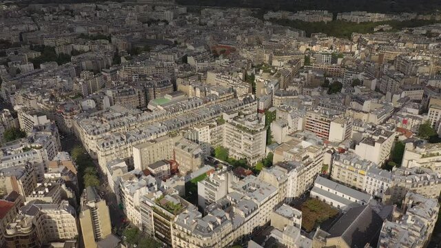 sunny evening paris cityscape flight over apartment buildings aerial topdown panorama 4k france