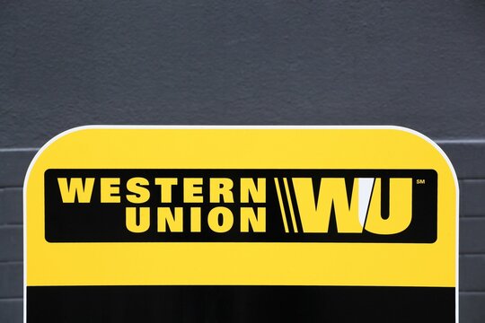 Tarare, France- June 27, 2020: Western Union sign and point. The Western Union company is an american financial services and communications company