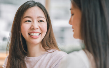 Portrait of woman talking with friend