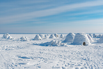Fototapeta na wymiar Winter dwelling of Eskimos. Igloo. Eskimos village.