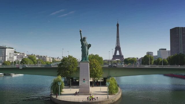 paris city river island statue of liberty monument traffic bridge tower district aerial panorama 4k france
