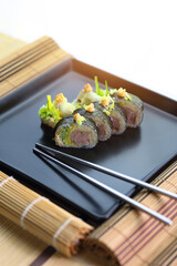 poultry sushi served in a colorful and appetizing way