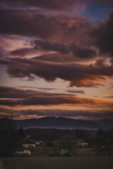 Sunset in countryside with mountains in the distance