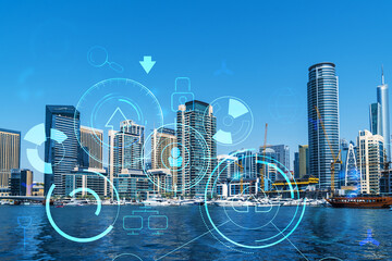 Skyscrapers of Dubai business downtown. International hub of trading and financial services. Technology theme icons hologram, concept of big data. Double exposure. Dubai Canal waterfront.