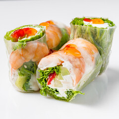 appetizing spring rolls with sea food and philadelphia cheese on a white background