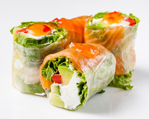 appetizing spring rolls with sea food and philadelphia cheese on a white background