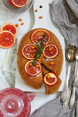 Orange pie with fruit tea on gray background