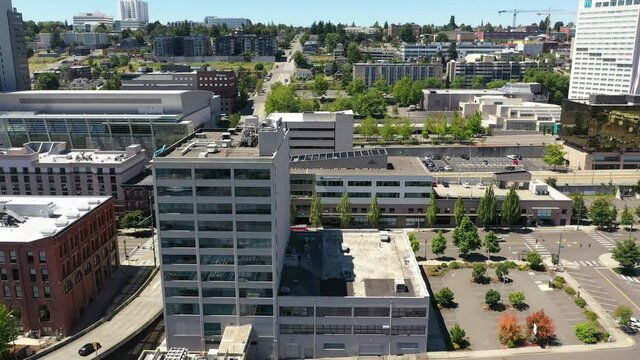 Cinematic drone footage of the Greater Tacoma Marriott Convention Center downtown Tacoma, a large city near Seattle in Western Washington, Pacific Northwest, the economic center of Pierce County