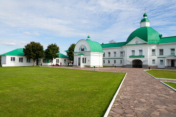 beautiful white monastery with green roof