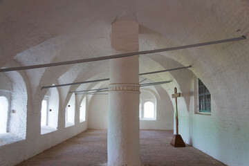 room inside the monastery with white walls