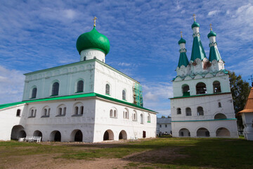 beautiful white monastery with green roof