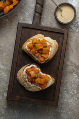 Italian Appetizer Bruschetta with roasted Pumpkin, Red Bell Pepper, Spinach, Garlic and Feta Cheese