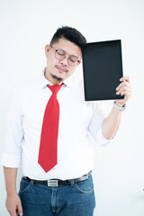 Expert in digital technologies. Cheerful young man in formal wear working on digital tablet and smiling while standing isolated on white background