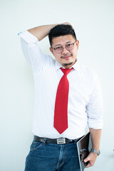 Expert in digital technologies. Cheerful young man in formal wear working on digital tablet and smiling while standing isolated on white background