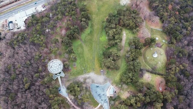 Aerial top down shot of park area with trees and Janos Xantus G&ouml;mbkilato Sphere Lookout in Balatonboglar.
