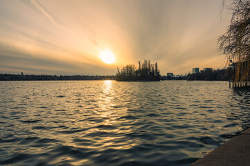Sunset over a lake in a city park