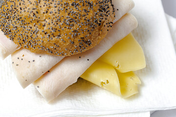 Homemade Sausage Sandwich with Lettuce and Cheese on Seed Bread