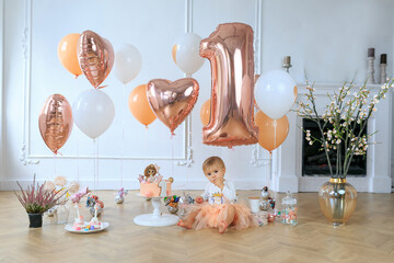 Little girl with gourmet cake and balloons. Smash cake concept. Funny toddler eating cake....