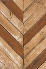 Aged wooden background of brown boards with joint in the middle - vertical
