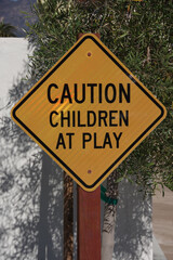 Close-up view of a traffic sign CAUTION CHILDREN AT PLAY