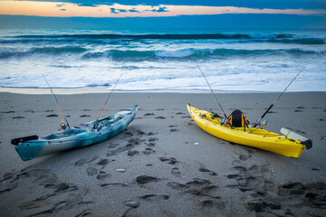 Two kayak on the beach waiting to fish - kayak fishing competition in the Mediterranean Sea - Marbella. Andalusia