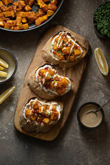 Italian Appetizer Bruschetta with roasted Pumpkin, Red Bell Pepper, Spinach, Garlic and Feta Cheese