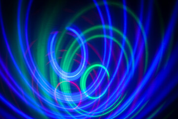 abstract background, colored circles on a black background, circles in motion