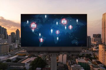 Glowing hologram of Earth planet map on billboard over aerial panoramic cityscape of Bangkok at sunset. The concept of international business in Southeast Asia.