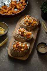 Italian Appetizer Bruschetta with roasted Pumpkin, Red Bell Pepper, Spinach, Garlic and Feta Cheese