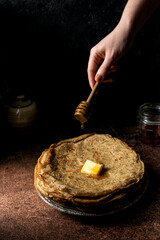 Russian blini with butter and honey