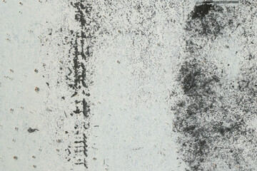 faded white paint on glass surface