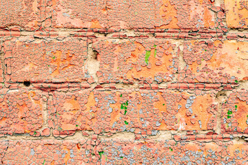 Texture of a brick wall with cracks and scratches which can be used as a background