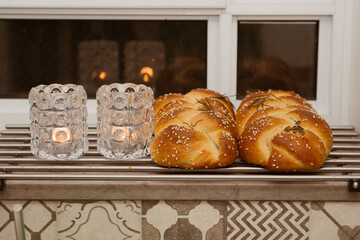 Shabbat image. Beautiful fresh challah bread and candles.