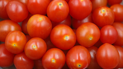 close up of fresh red cherry tomatoes, background of red vegatables