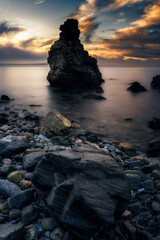 Sunrise on a beach with rocks