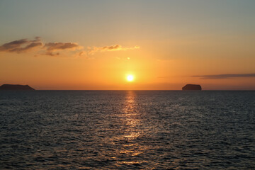 Fototapeta na wymiar Sunset over Daphne Major and Minor in Galapagos